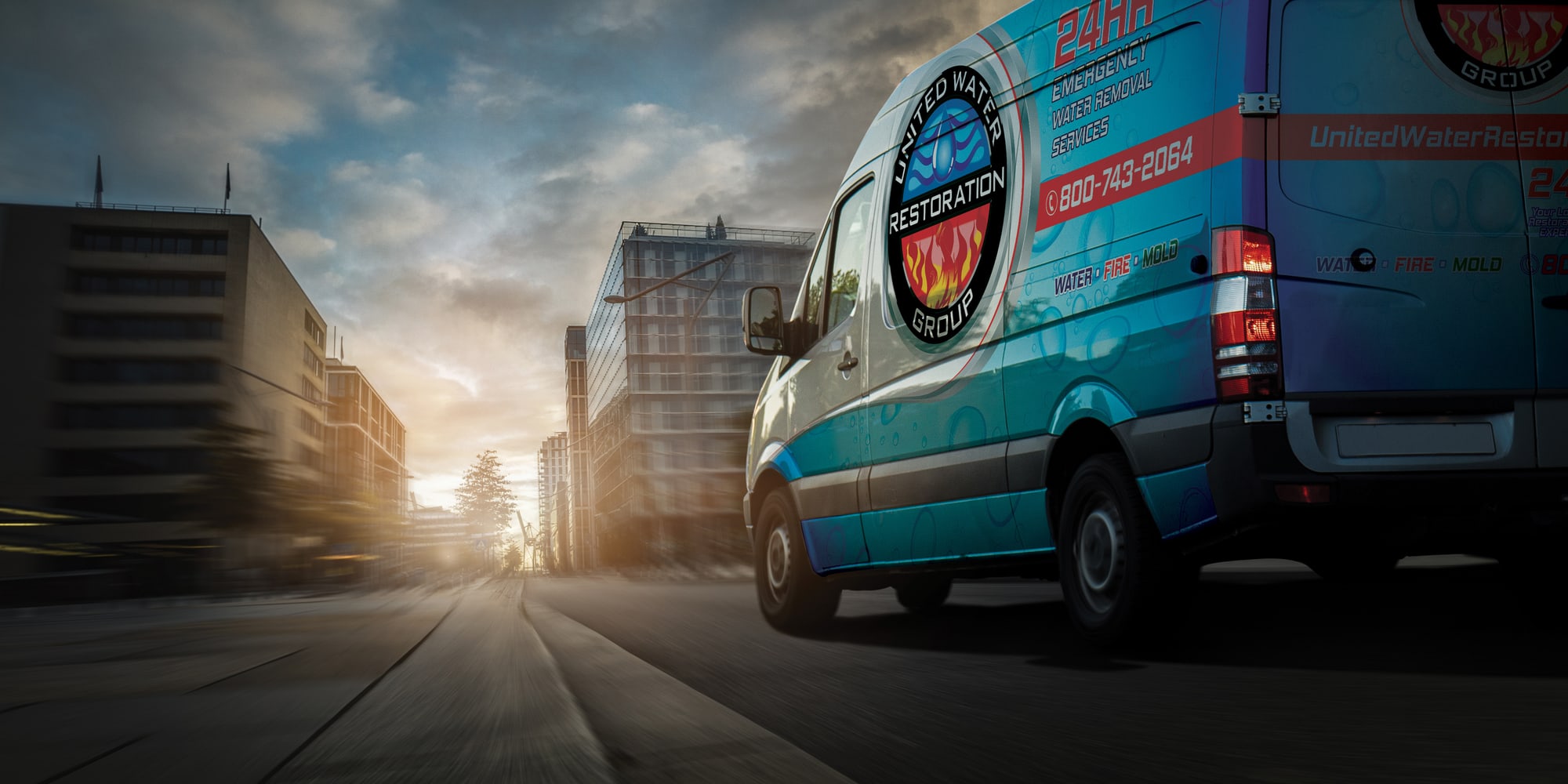 A United Water Restoration Group of Sacramento Northeast van heading out on an emergency call at sunset