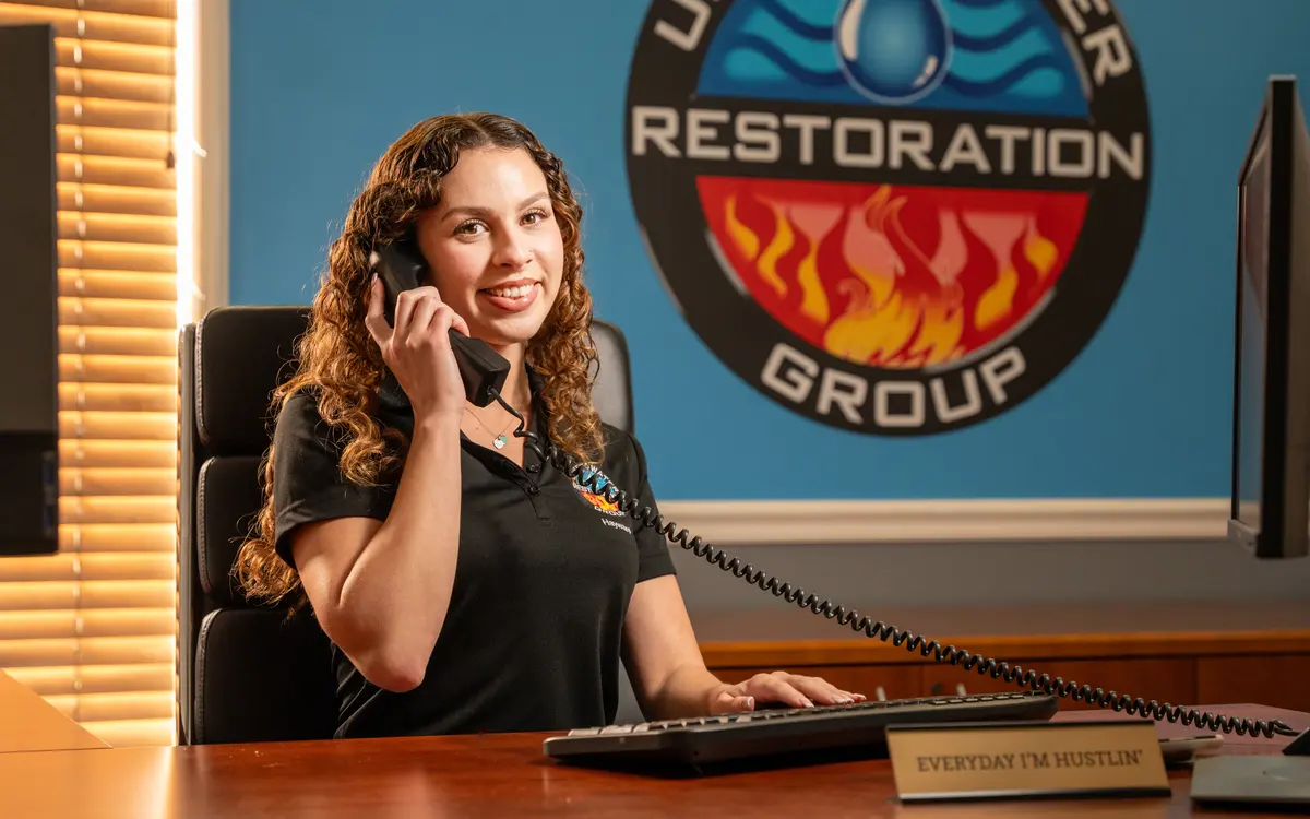 A dispatcher at her desk answering the phone